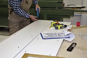 Carpenter At Work Prints: Carpenter at work in his carpentry workshop