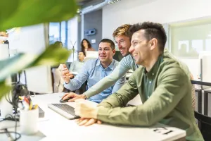 Modern Office Collaboration Prints: Programmers collaborating on code in a bright
