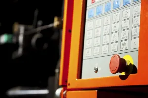 Industrial Building Design Prints: Complex machine computer control panel with emergency button