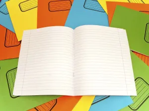 Laptop Computer Desk Setup Prints: Open Lined Notebook At The Stack Multicolored Notebooks Background