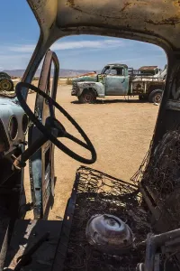 Barren Namib Desert Scenery Prints: Wreck of an oldtimer in the desert