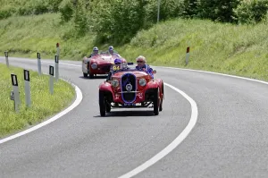 Red Classic Car Prints: Red classic car in a sharp bend