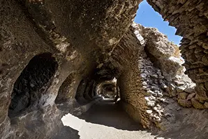Deserted Sacral Building Prints: Cave system in the Takht-e Rostam stupa monastery complex