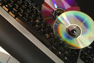 Computer Keyboard Prints: Cd romes on computer keyboard