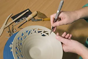 Decorative Ceramics Prints: Ceramic artist working in her workshop