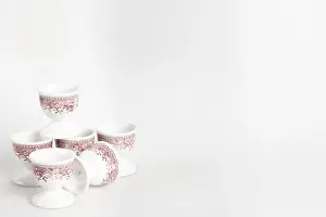 Bright Studio Background Prints: Ceramic egg cup with reddish pattern on white background