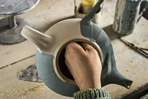 Ceramic Workshop Prints: Ceramic workshop, finished pot is painted blue