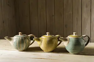 Handmade Ceramics Prints: Ceramic workshop, three glazed pots on workbench