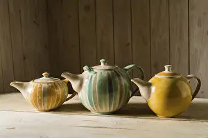 Handmade Ceramics Prints: Ceramic workshop, three glazed pots on workbench