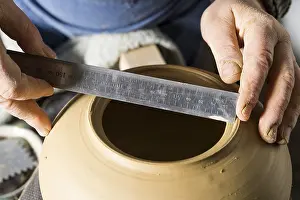 Ceramic Workshop Detail Prints: Ceramic workshop, hands measuring diameter of opening with ruler