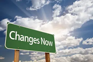 Dramatic Clouds Prints: Changes now green road sign with dramatic clouds
