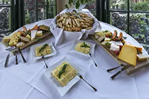 Empty Buffet Table Setup Prints: Cheese buffet, bread and cheese on a round table