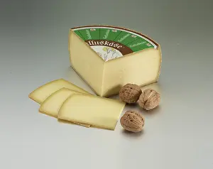 Decorative Food Photography Prints: Cheese on a light background, decorated with walnuts