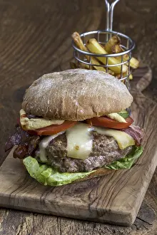 High Calorie Cheeseburger Prints: Cheeseburger with chips on wood