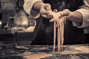 Italian Cuisine Prints: The chef makes fresh spaghetti from scratch