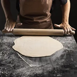 Kitchen Utensils For Cooking Prints: Chef using rolling pin dough