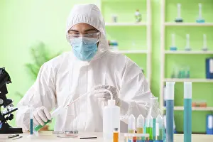 Scientific Experiment Setup Prints: Chemist working in the lab on new experiment