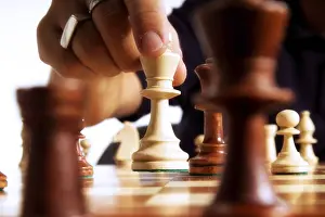 Chess Player Prints: Chess player making a move