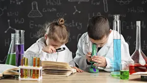 Science Education For Children Prints: Children doing experiments laboratory