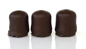 Rich Desserts Prints: Three chocolate-covered marshmallows