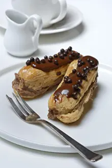 Empty Plate Meal Prints: Two chocolate eclairs on a plate