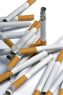 Isolated Cigarette Cutout Prints: Few cigarettes lying on a white background