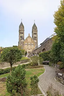 Prints of Clervaux, Luxembourg - October 3, 2022: Cityscape with roman catolic church Saints-Come-Et-Damien of Clervaux in Luxembourg Heritage Site Prints: Clervaux Cityscape Print, Luxembourg - October 3, 2022