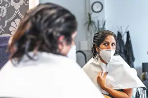 COVID 19 Safety Measures Prints: Client with face mask looking in the mirror