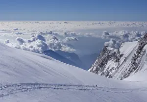 Prints of Two climbers above the clouds on Monte Rosa, Alps, Valle d'Aosta, Italy Two climbers above the clouds on Monte Rosa, Alps, Valle d'Aosta, Italy Valle DAosta Prints: Two Climbers Above the Clouds Print, Monte Rosa, Italy