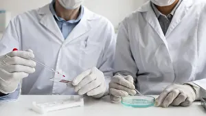 Teamwork In Healthcare Prints: Close up scientists working together