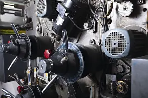 Industrial Equipment Prints: Close-up on complex detail of typography machine