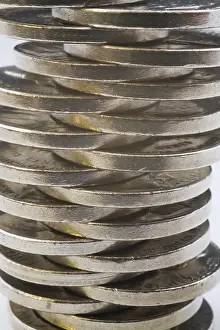 Empty White Space For Text Prints: Close-up of evenly lopsided stack of US five cent coins on white background