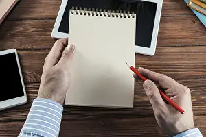 Scientist At Work Prints: Close-up of hands with notepad. office work
