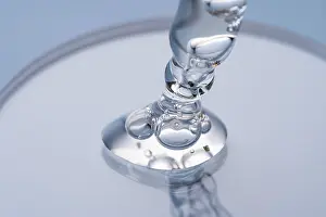 Cosmetic Pipette Prints: Close-up image capturing the delicate movement of a clear