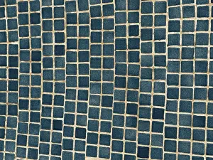 Symmetrical Geometric Pattern Prints: A close-up of a surface adorned with small