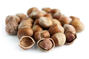 Studio Shot Of Hazelnuts Prints: Closeup of whole and cracked hazelnuts