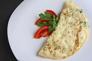 Organic Vegetable Cultivation Prints: Closeup of omelet with ham and vegetables
