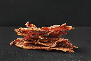 Thinly Sliced Meat Prints: Closeup view of stack of dried pork jerky