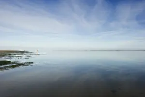 Overcast Sky Waterfront Scene Prints: Cloud reflection in the mudflats