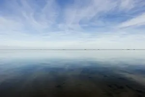 Cloudy Sky Reflections Prints: Cloud reflection in the mudflats