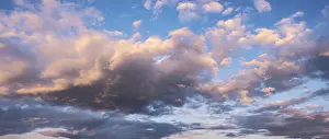 Cloudy Atmospheric Light Prints: Clouds in the evening light, panorama