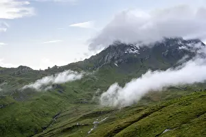 Mountainous Region Switzerland Prints: Clouds move around mountain peaks