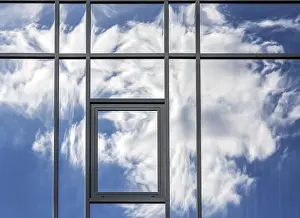 Deserted Building Exterior Prints: Clouds are reflected in the house facade