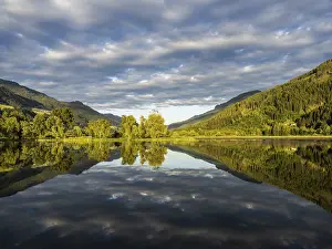 Images Dated 13th June 2024: Clouds are reflected in the lake Print, Gaishorn am See, Austria