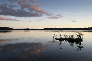 Evening Atmosphere Photos Prints: Clouds reflected on the water surface