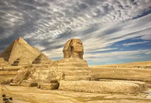 North African Landmarks Prints: Clouds over Sphinx and pyramids in Cairo, Egypt