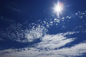 Cloudy Sky Austria Prints: Cloudy sky with altocumulus clouds and sun rays