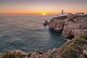 Lighthouse At Sunset Prints: Coast with lighthouse at sunset