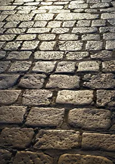 Cobblestone Road Surface Prints: Cobblestone pavement in the backlight