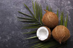 Healthy Eating Photography Prints: Coconut over black rustic background